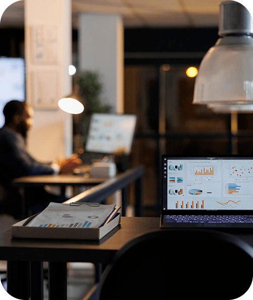 Office workspace with computer showing financial data